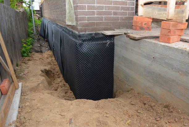 Happy homeowners after waterproofing job in Nichols